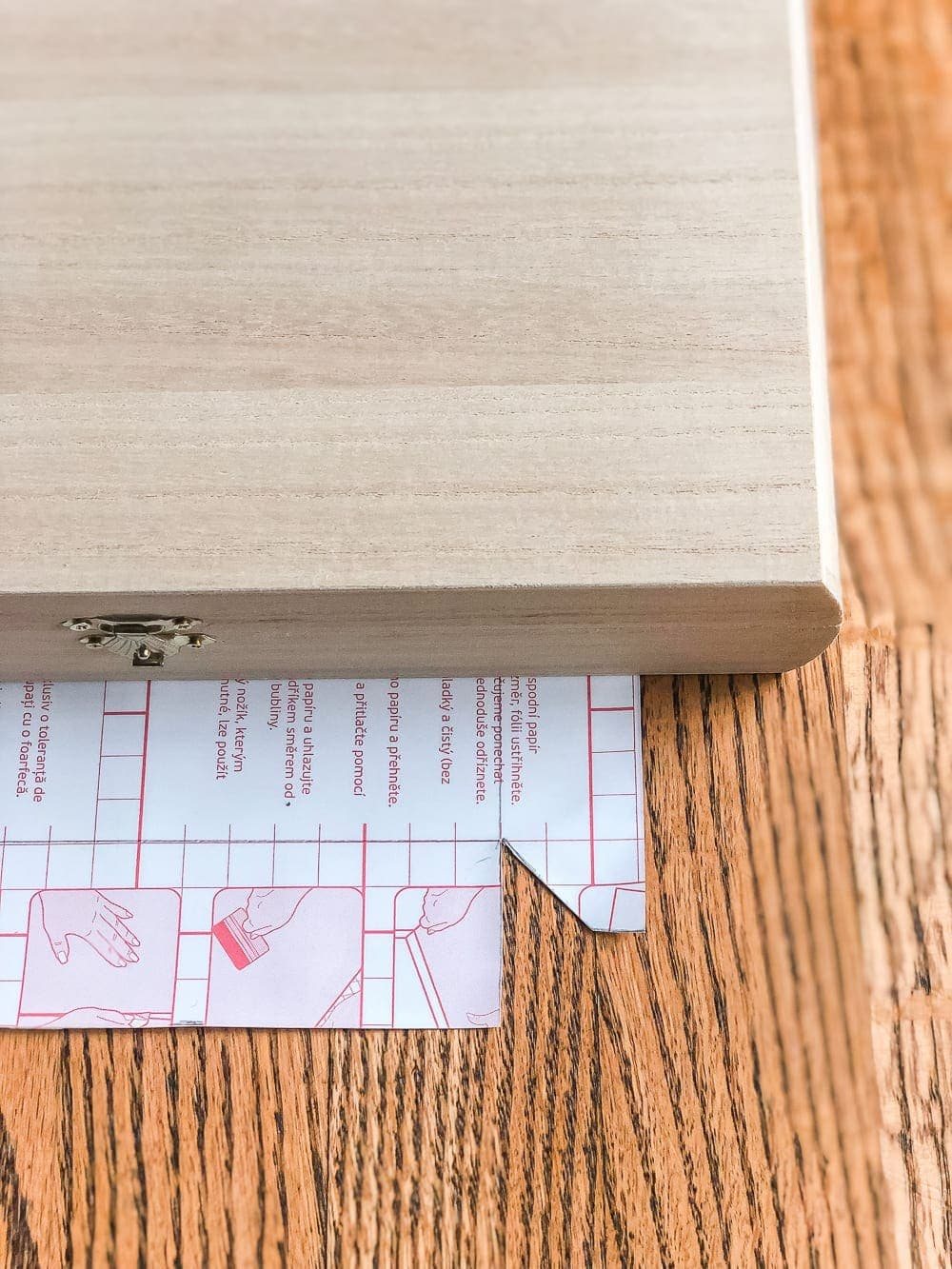 How to wrap a cigar box with contact paper to repurpose into a decorative remote control holder for a coffee table. #remotecontrolholder #coffeetabledecor