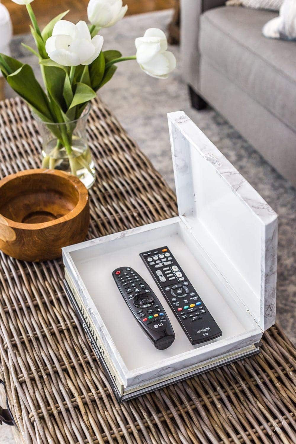 How to wrap a cigar box with contact paper to repurpose into a decorative remote control holder for a coffee table. #remotecontrolholder #coffeetabledecor