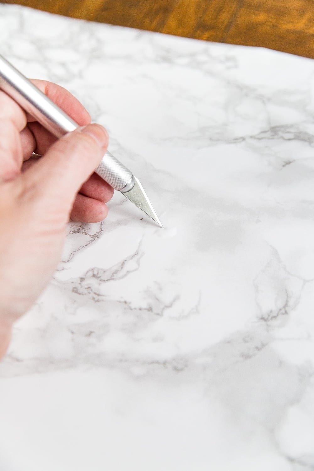 Contact paper tip - poke small holes in air bubbles to press them out