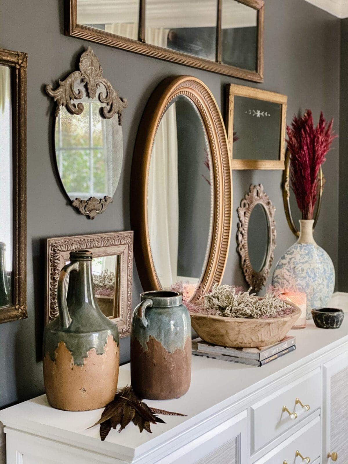 dried pampas grass and preserved flowers on a dining room sideboard for fall decor
