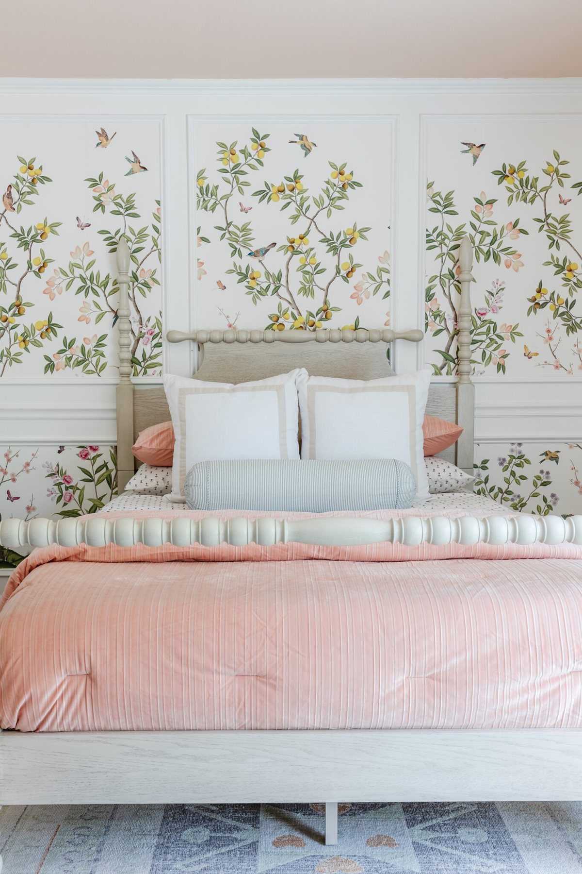 little girls bedroom with pink bedding and chinoiserie wallpaper