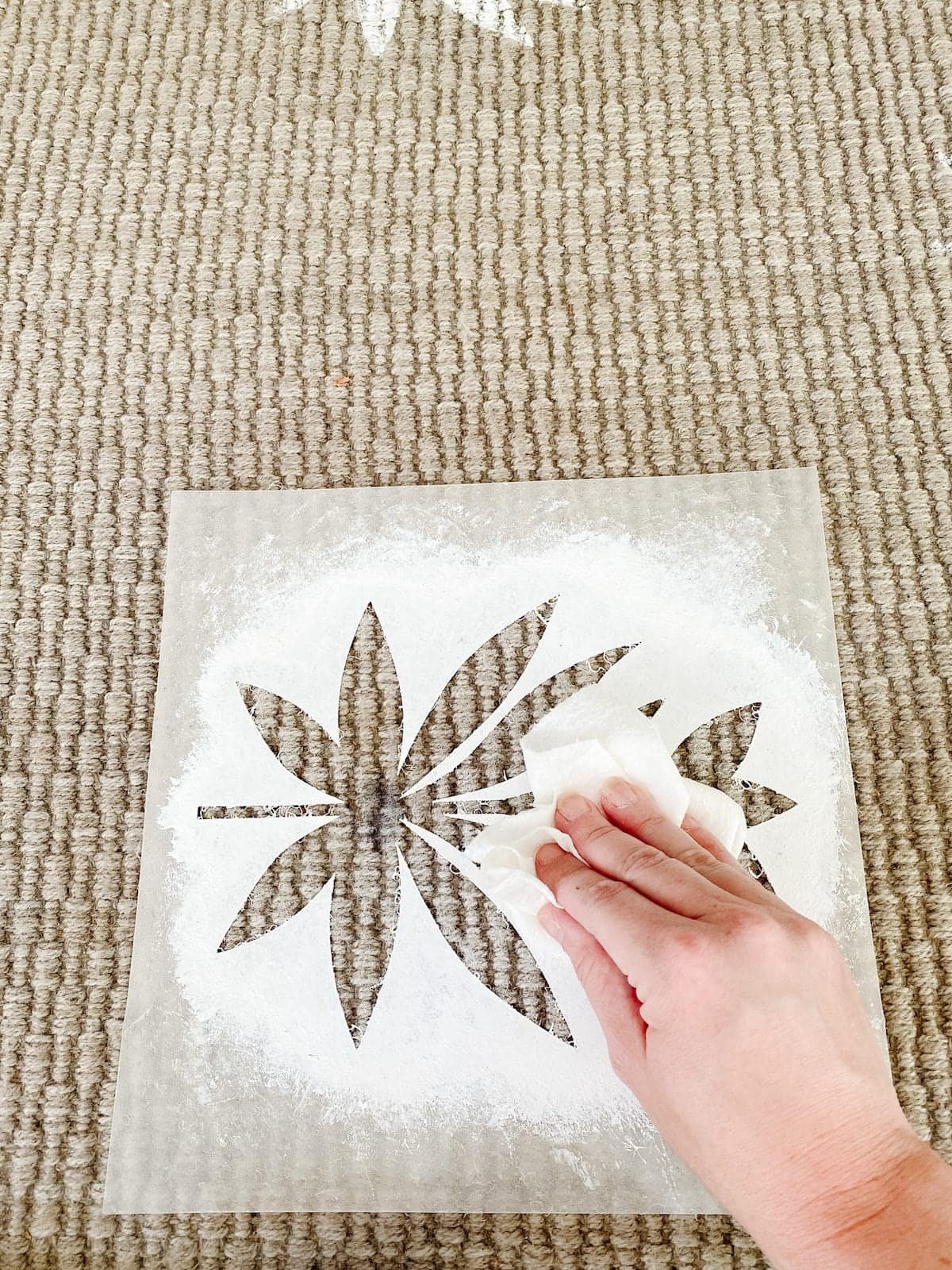 stenciling an outdoor rug with a floral block pattern