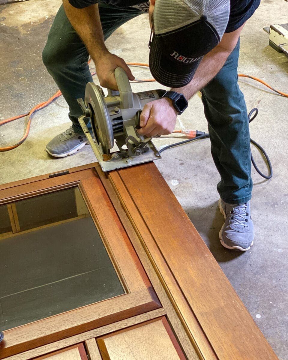 Footed Grasscloth Buffet Makeover - Removing the bottom board to add decorative feet