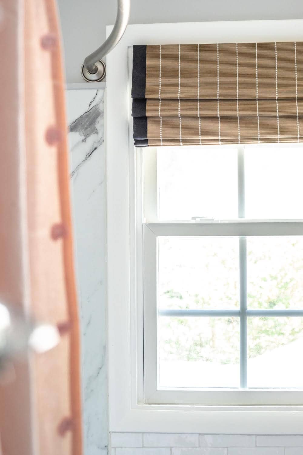 Girls' Bathroom Decor Details & Sources | woven window shade, faux marble shower walls