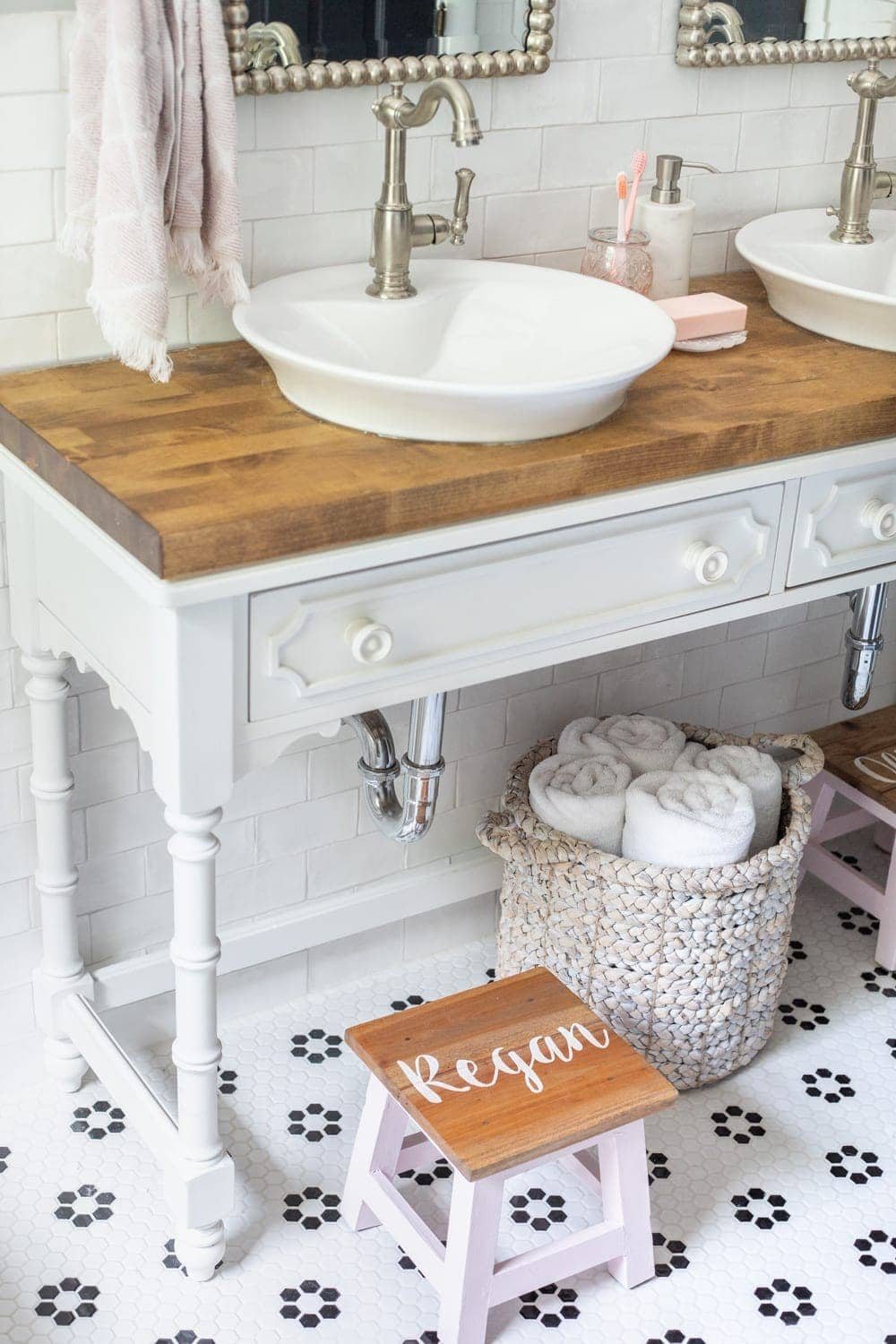 Girls' Bathroom Decor Details & Sources | Console table converted into a vanity with vessel sinks and personalized step stools