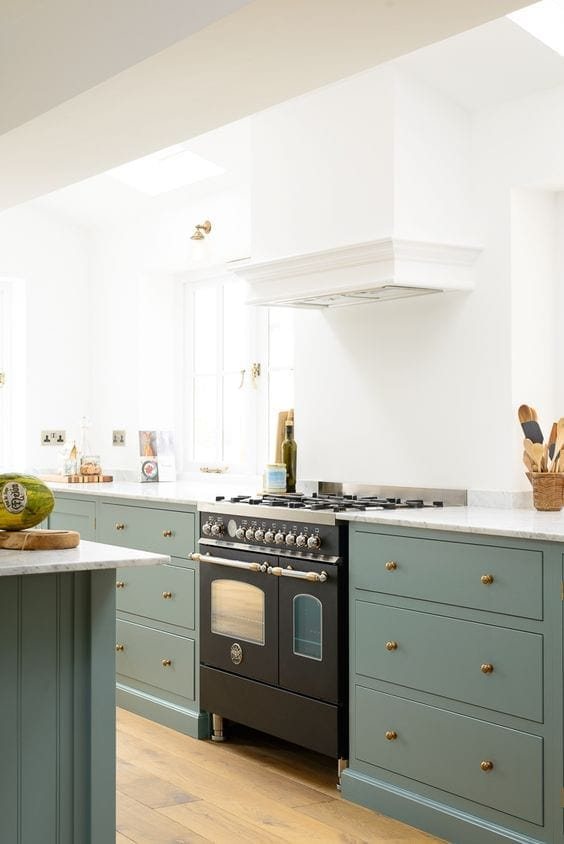 A round-up of the best green kitchen cabinet paint colors for the hottest bold kitchen color trend. #greenkitchen #kitcheninspiration #paintcolors #greenpaint #kitcheninspiration #boldkitchen #greencabinets #greenpaintcolor #paintinspiration #kitchentrend