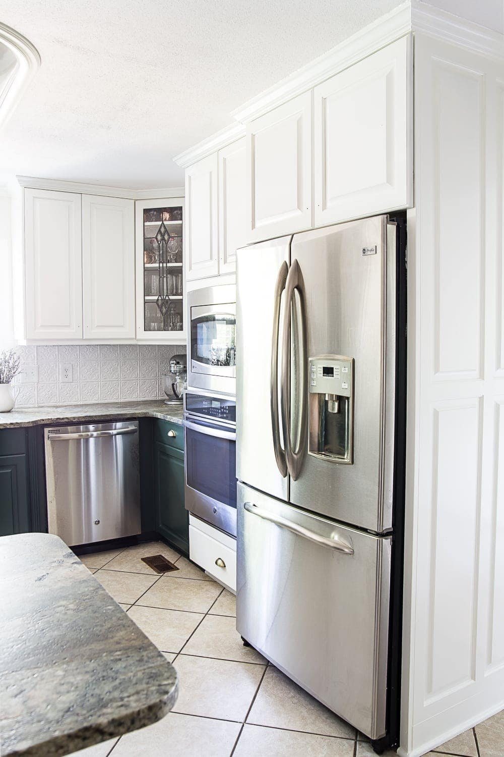 white upper and green lower kitchen cabinets stopping at wall oven & refrigerator