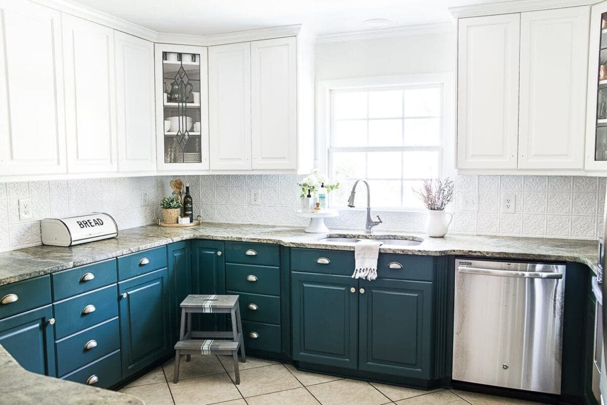 white upper cabinets and green lower cabinets in the color Benjamin Moore Simply White and Sherwin Williams Billiard Green