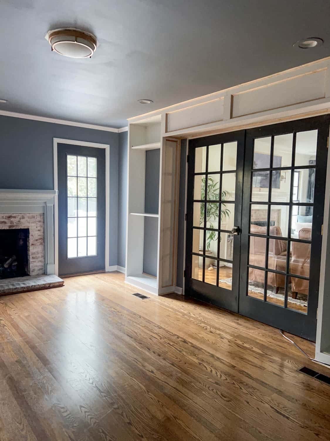 French doors with IKEA billy bookcases built in