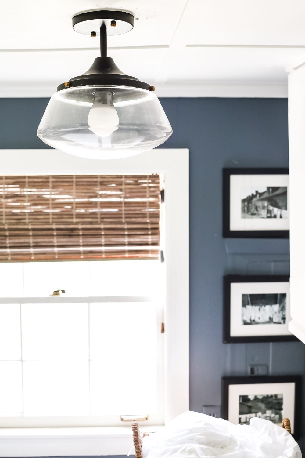 High Contrast Laundry Room Makeover | unigumushane.com - A dingy and dated laundry room gets a high contrast navy and white makeover packed with organizational strategies and budget-conscious DIY projects.