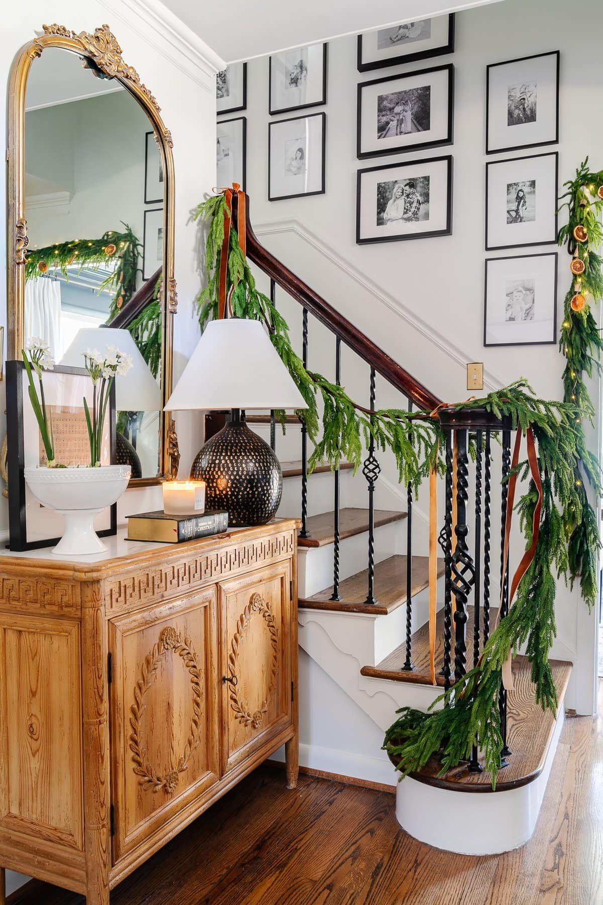 realistic garland on stairs for Christmas decor in foyer