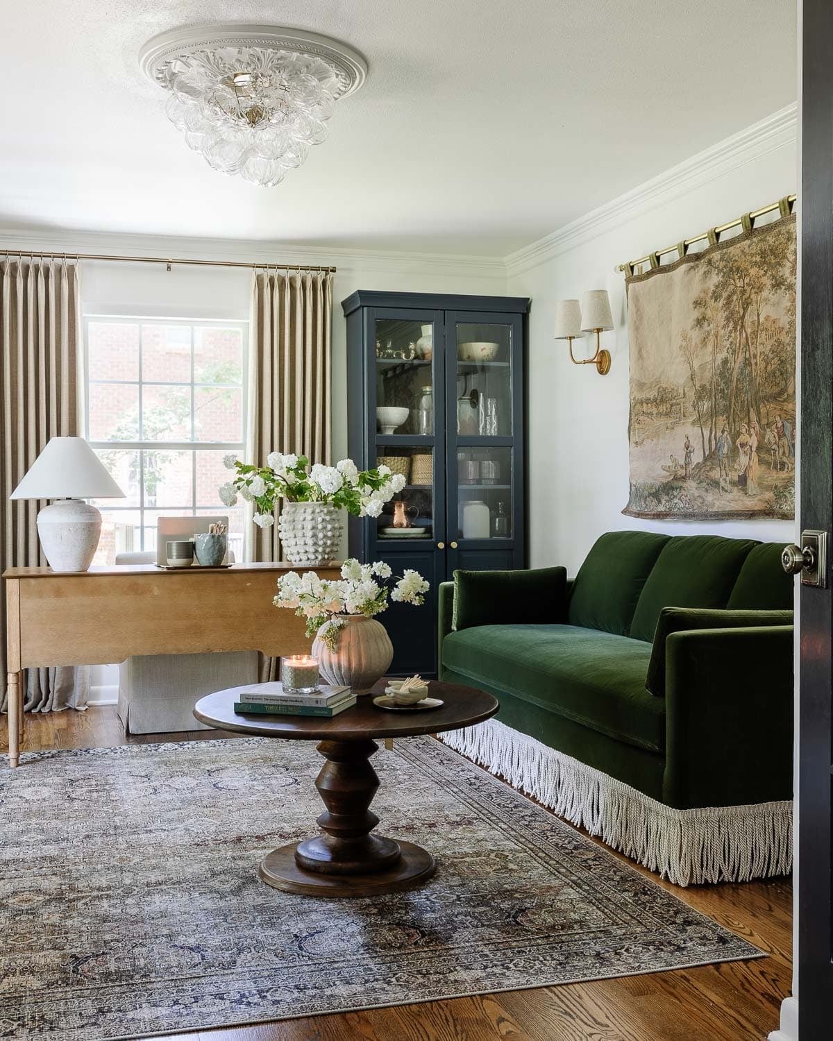 home office layout with sofa and desk for working with clients