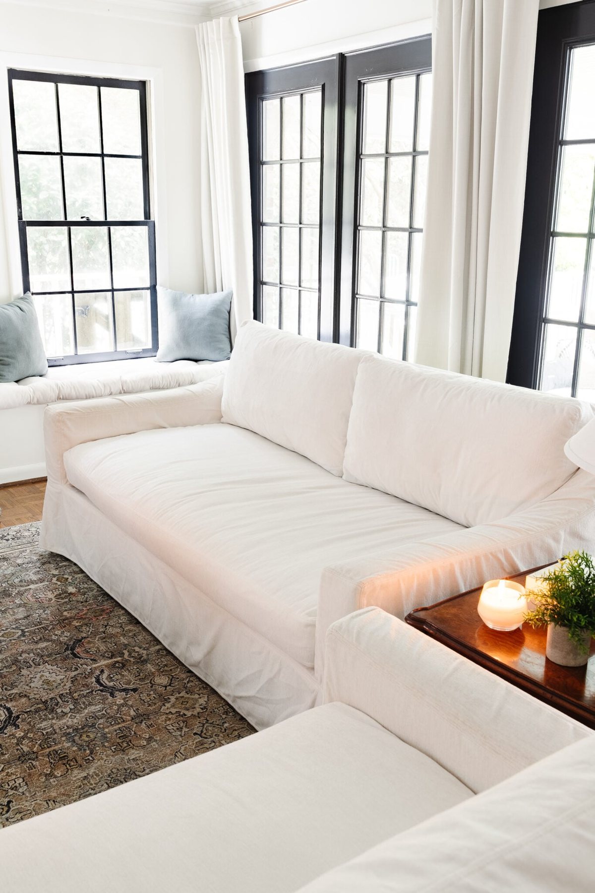 white clean couch in a living room with white slipcover
