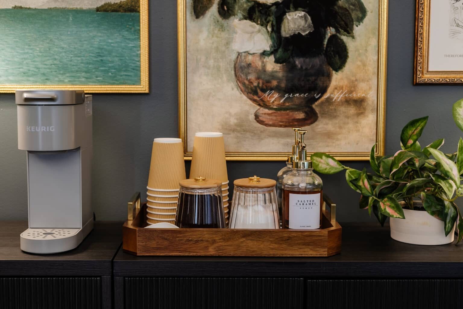 sideboard, gallery wall, and coffee station in a conference room
