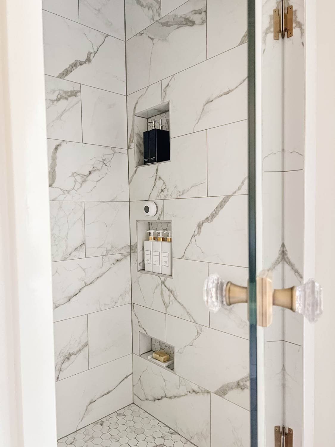 organized shower minimalist shampoo bottles