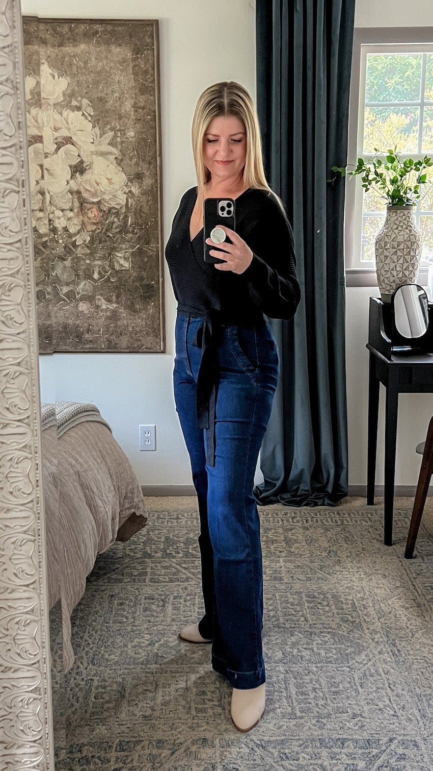 black wrap top and trouser jeans outfit to hide a belly