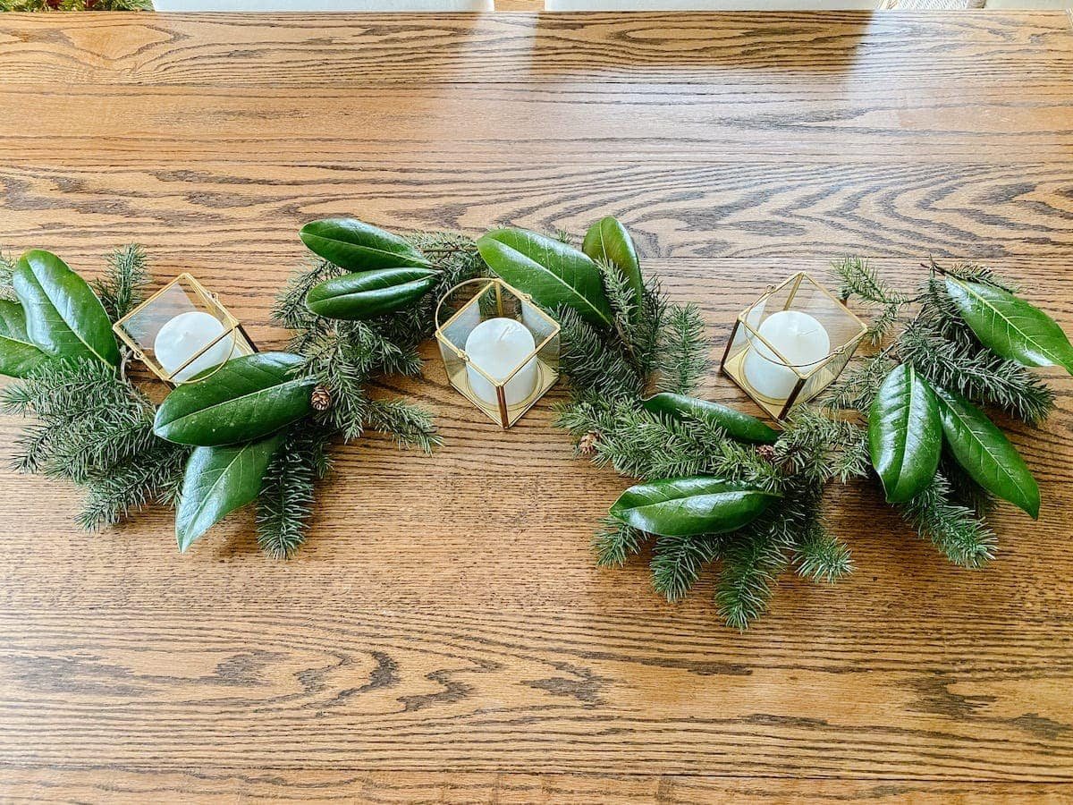 How to make cheap Christmas garland look high-end adding magnolia leaves