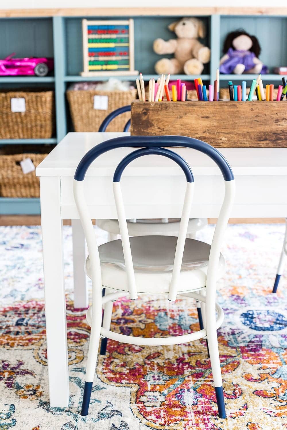 A dated, unorganized playroom gets a bright and whimsical makeover with organizational strategies, ideas for adding function, and DIY-able projects to create the perfect kid's space on a budget. #kidsroom #playroom #kidsdecor #toyorganizing