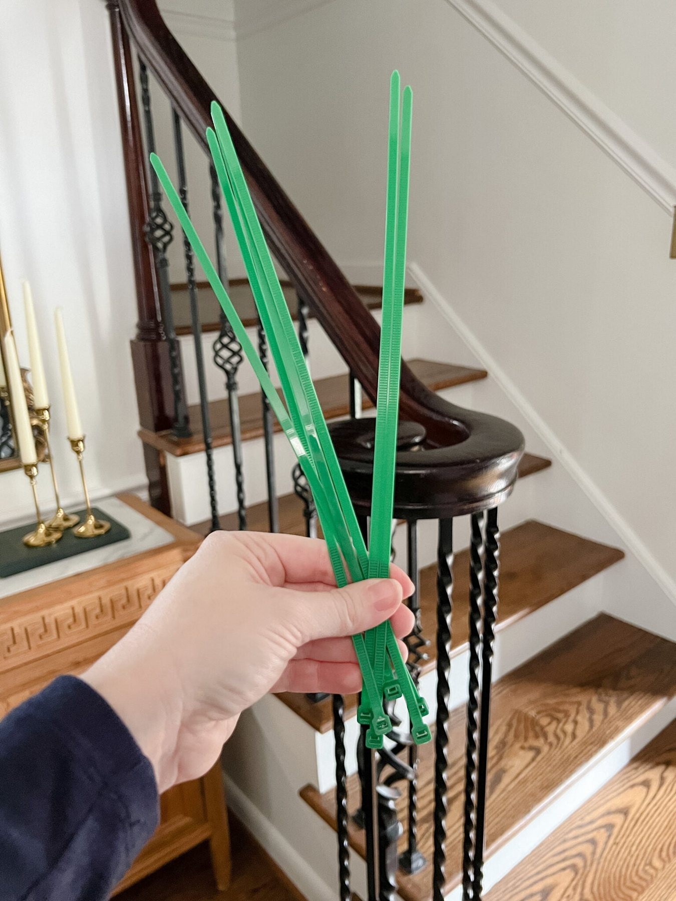 zip ties used for hanging garland on banister