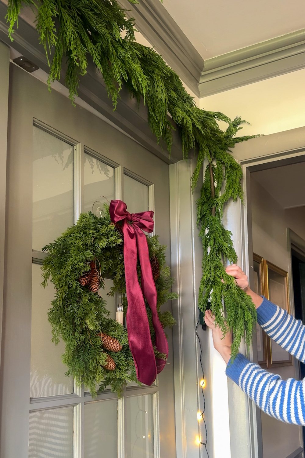 how to hang doorway garland inside with no damage for Christmas