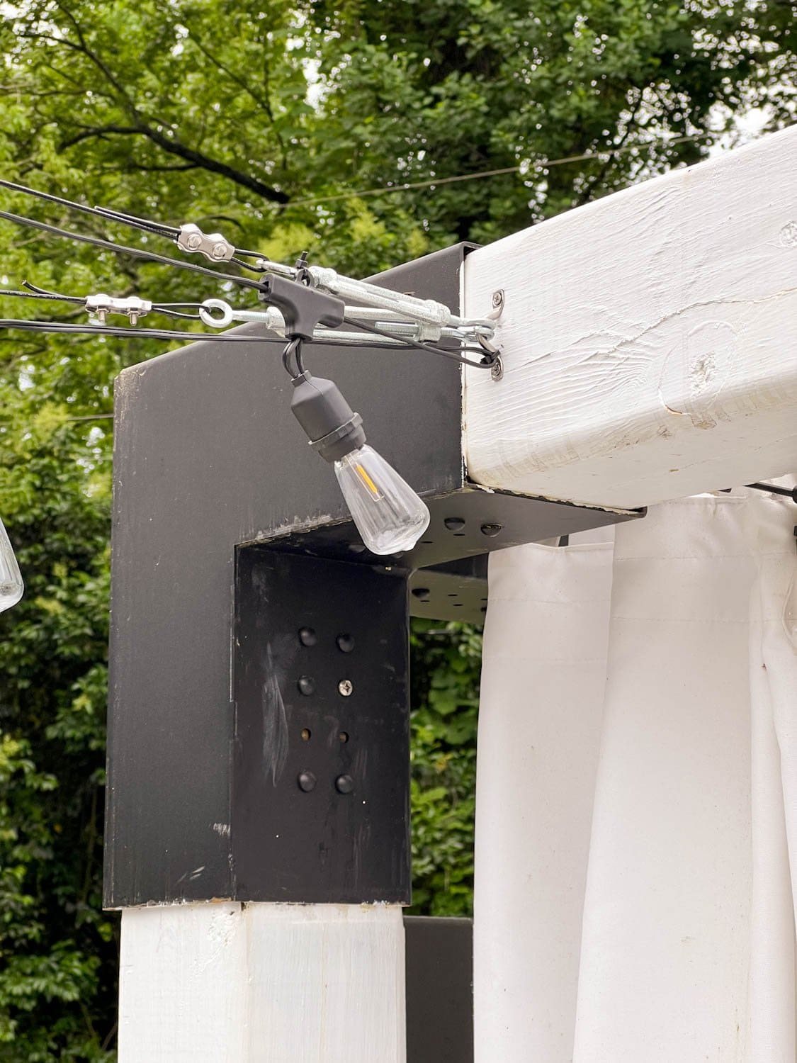hanging lights from a pergola using cables