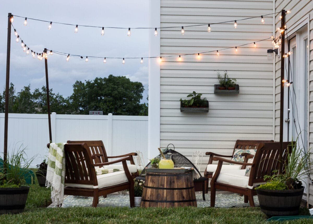 How to Decorate a Small Patio | unigumushane.com - Utilize a small patio space with chairs at each corner and a fire pit in the middle for function and entertainment. Add outdoor string lights for a cozy ambience.