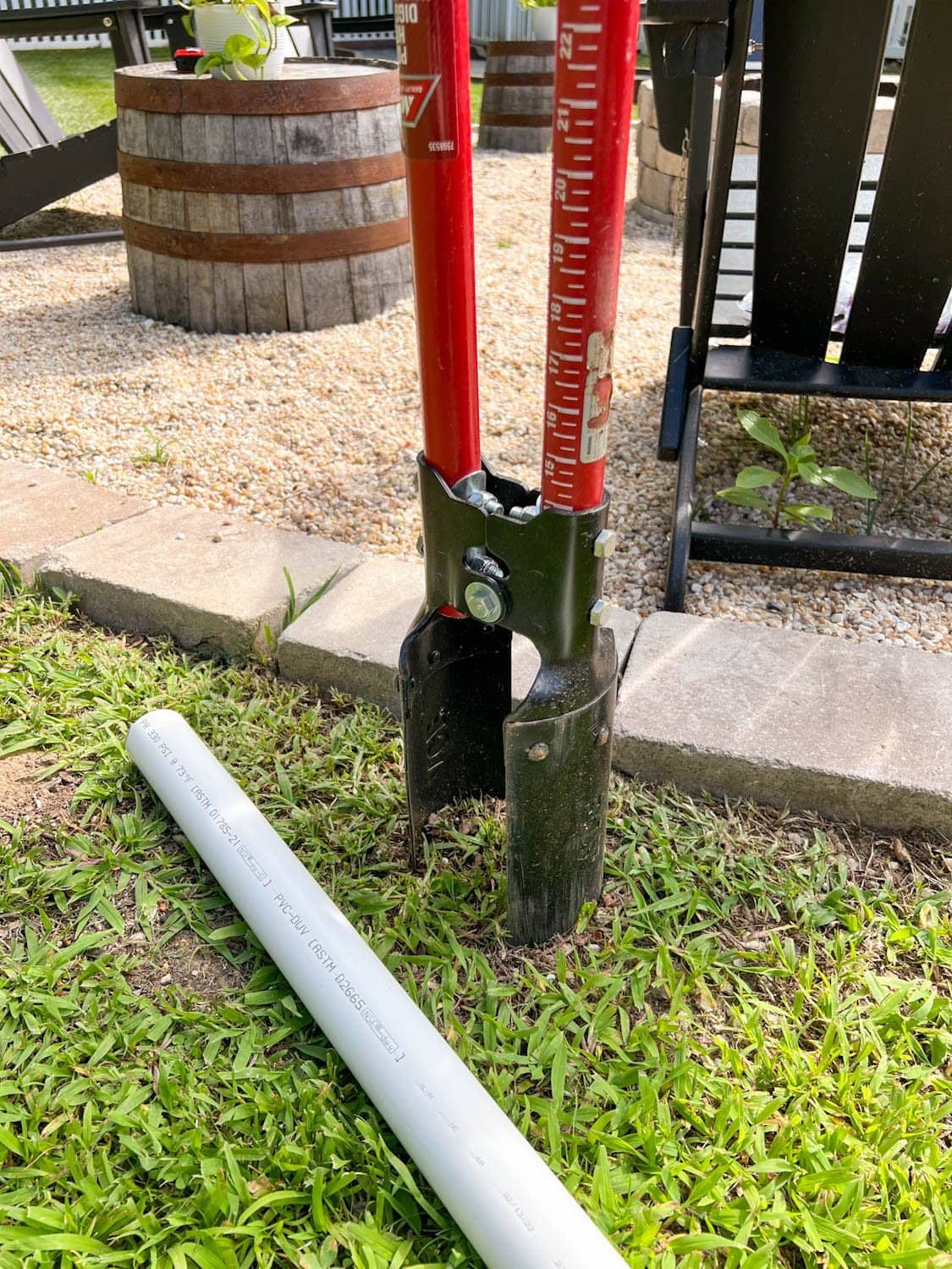 a post hole digger and 2' long PVC pipe