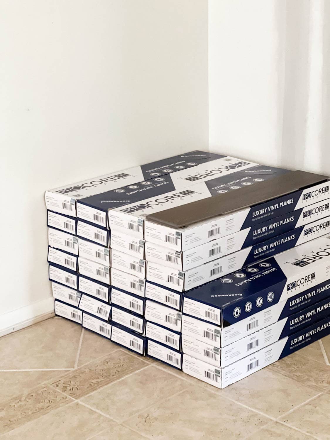 stack of ProCore Floors luxury vinyl plank floors on top of tile