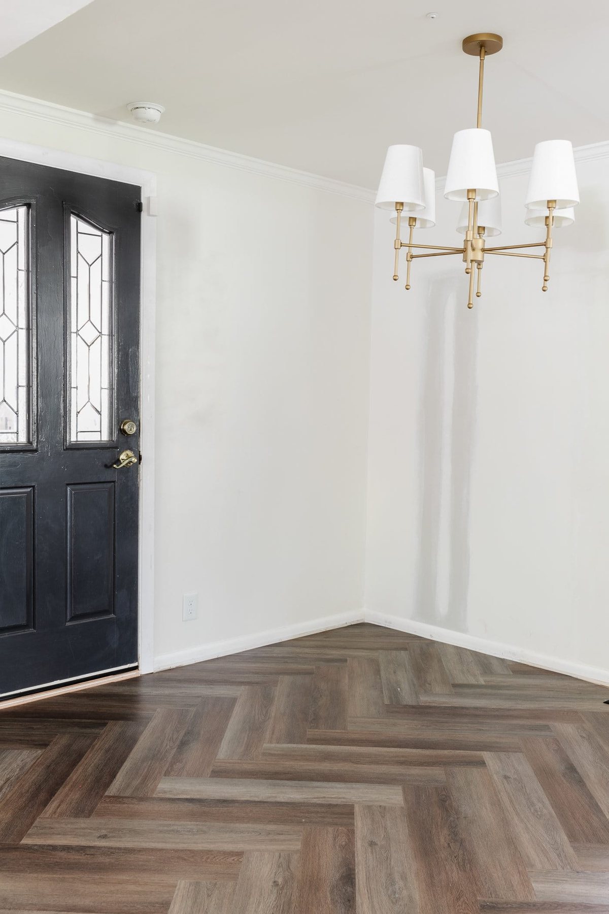 finished herringbone LVP floating floor installation in a breakfast nook
