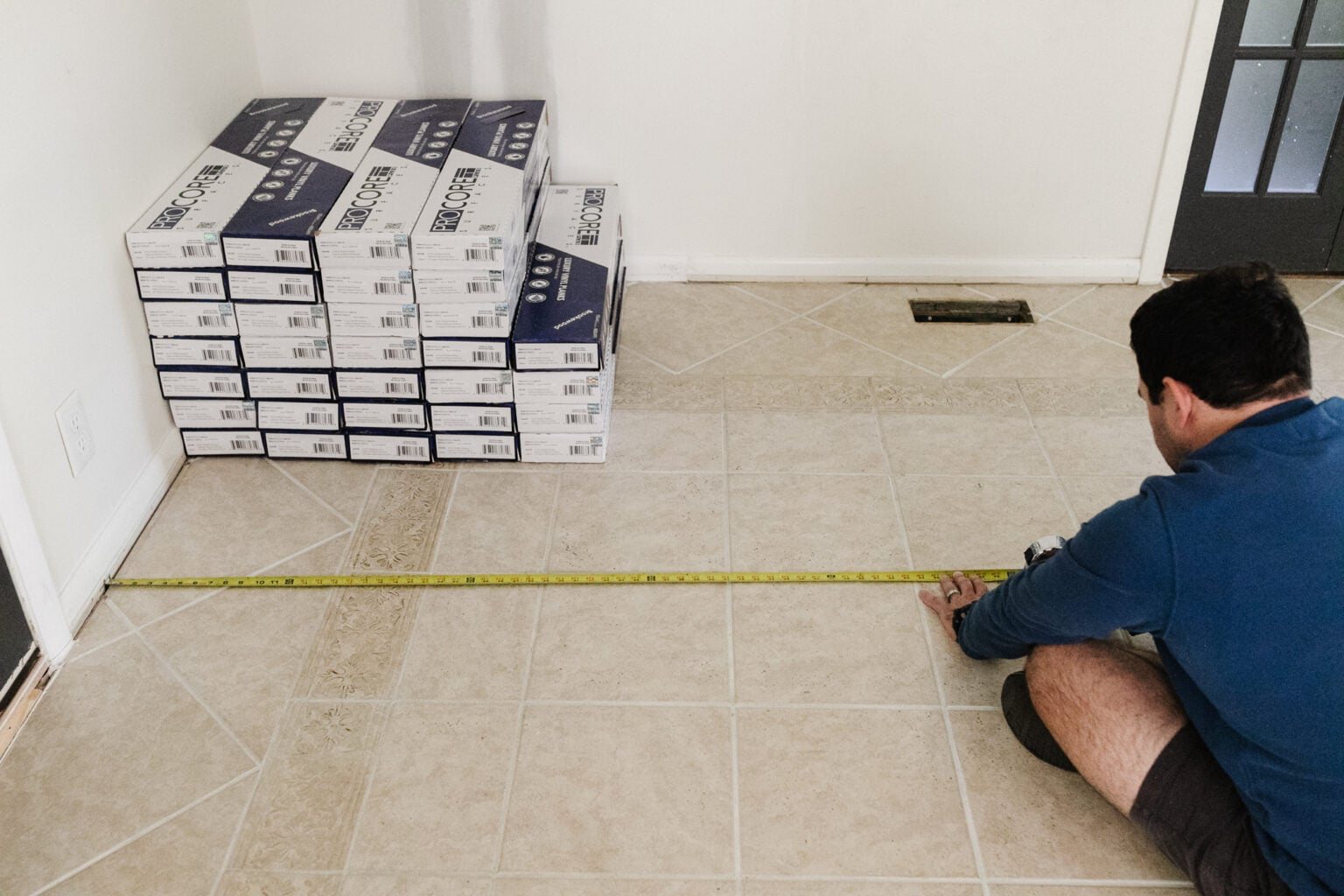 measuring a tile floor to install herringbone LVP floating floor