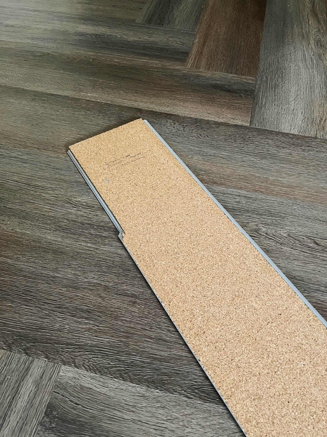 cork LVP underlayment in herringbone pattern
