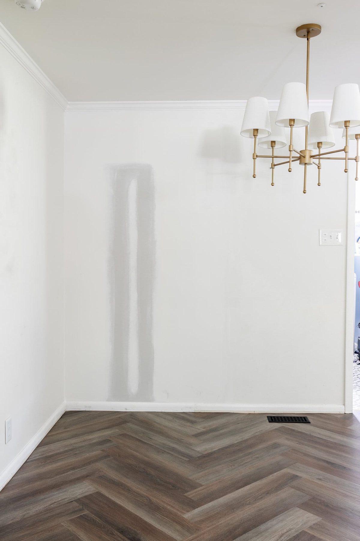 finished herringbone vinyl floor in a breakfast nook