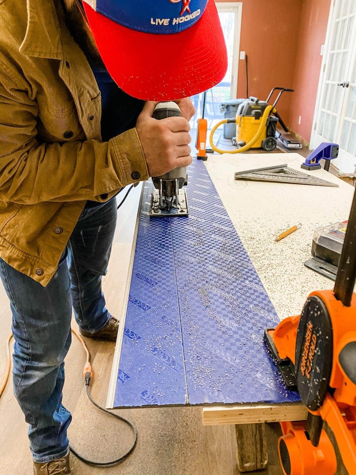 using a jigsaw to cut luxury vinyl plank flooring