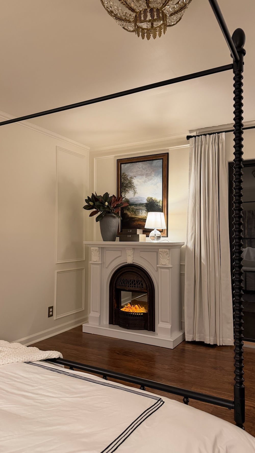 classic modern french country bedroom with layered lighting and canopy bed