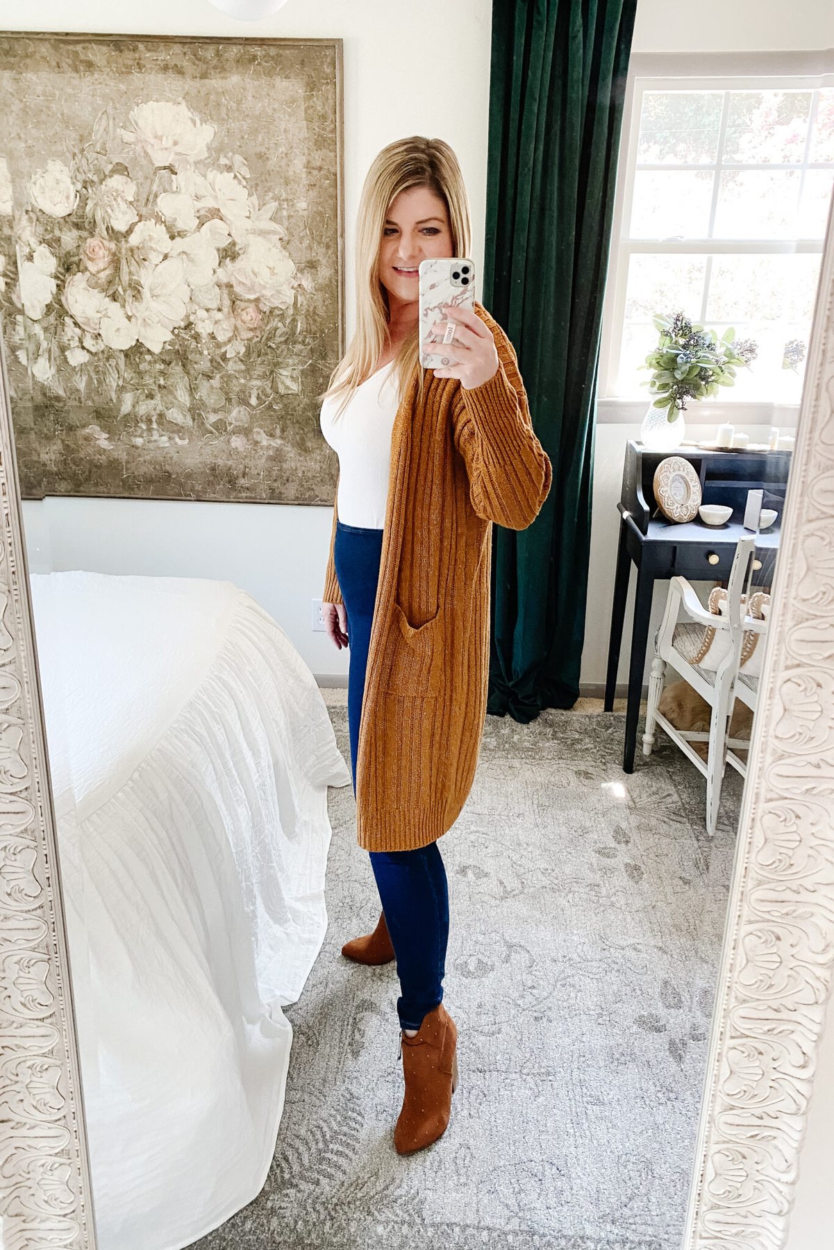 Slimming fall outfit idea: long cardigan, tucked top, dark wash high waist jeans, pointed toe boots