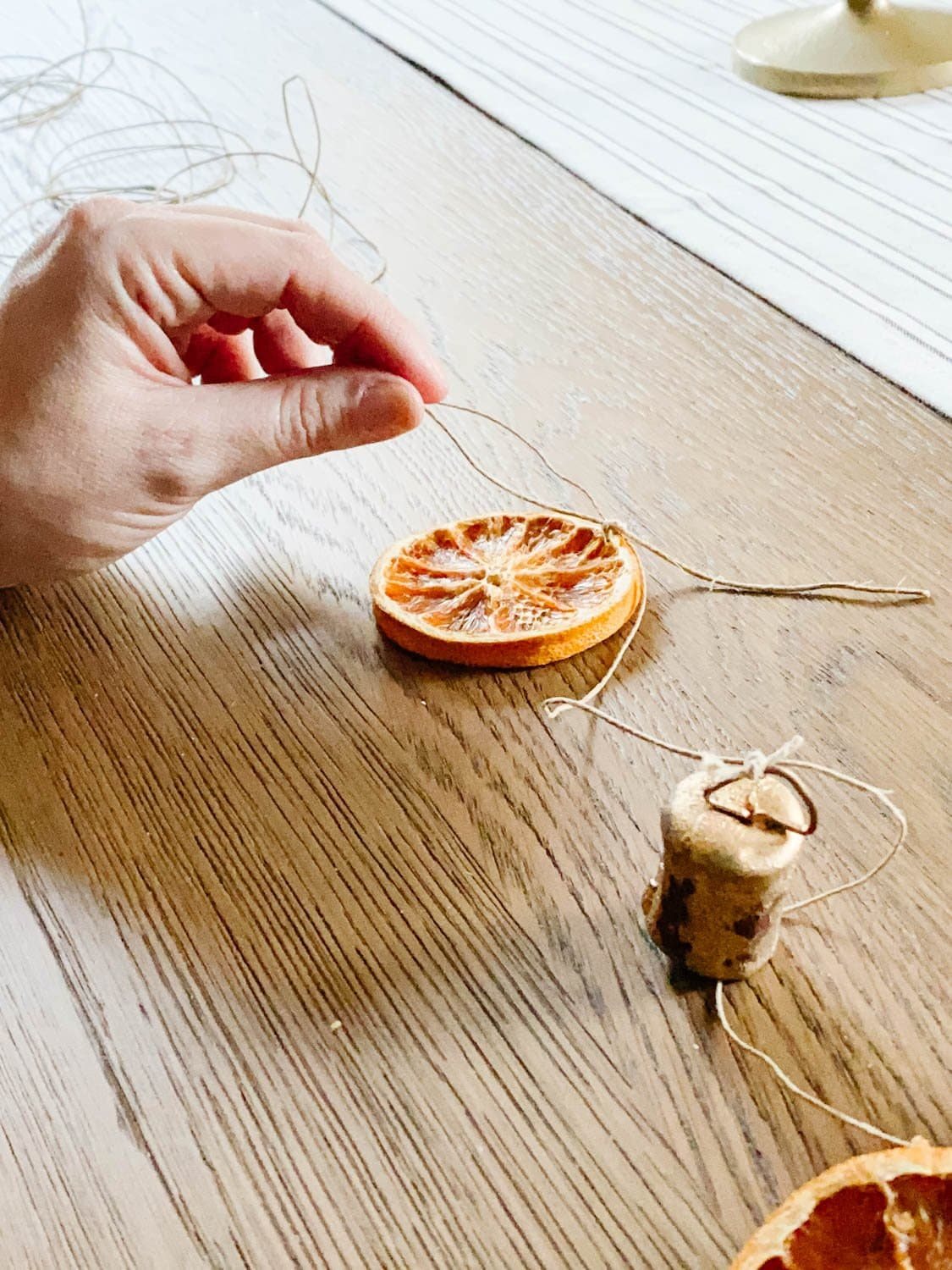 how to tie dried orange slices onto garland