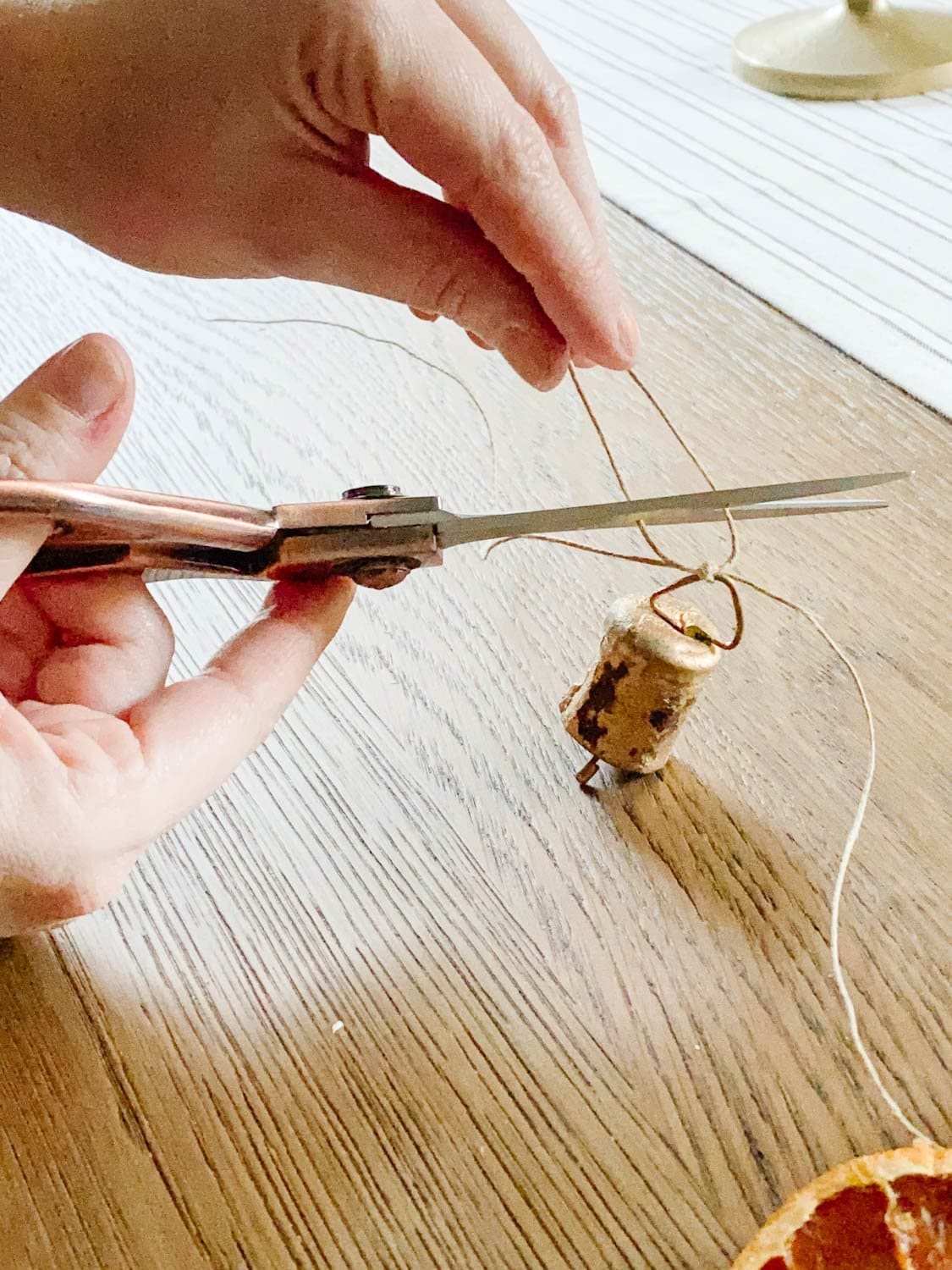 cutting long ends of twine on mini brass bells