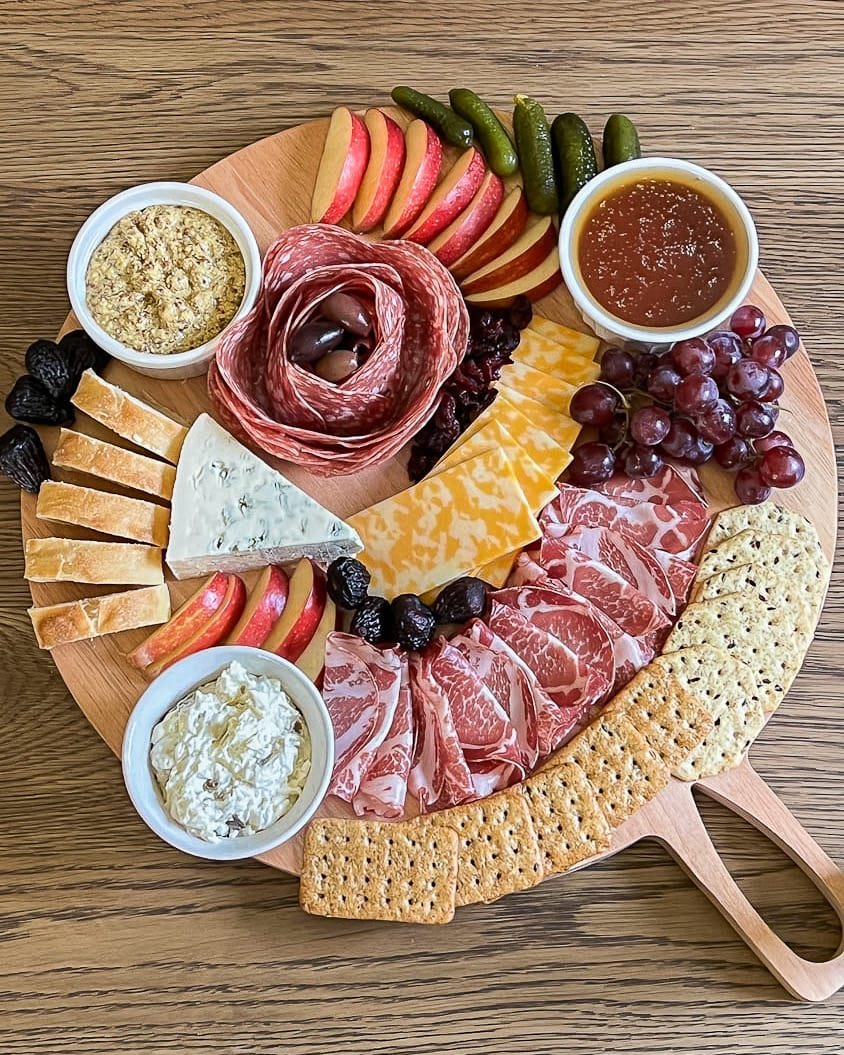 simple charcuterie board with savory ingredients added