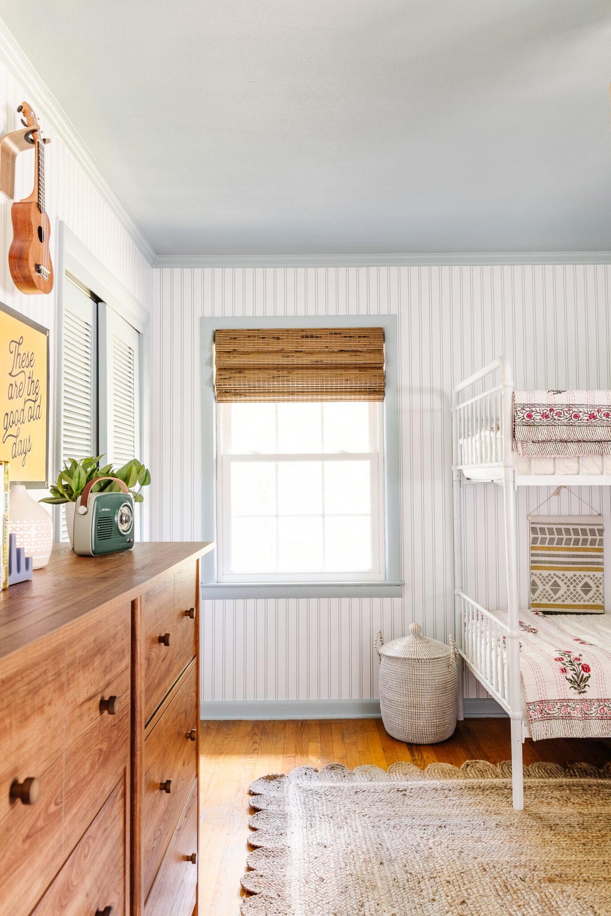 bunk room with vertical stripe wallpaper