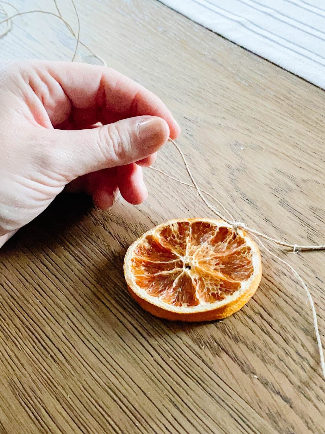 dried orange slice made into garland using twine