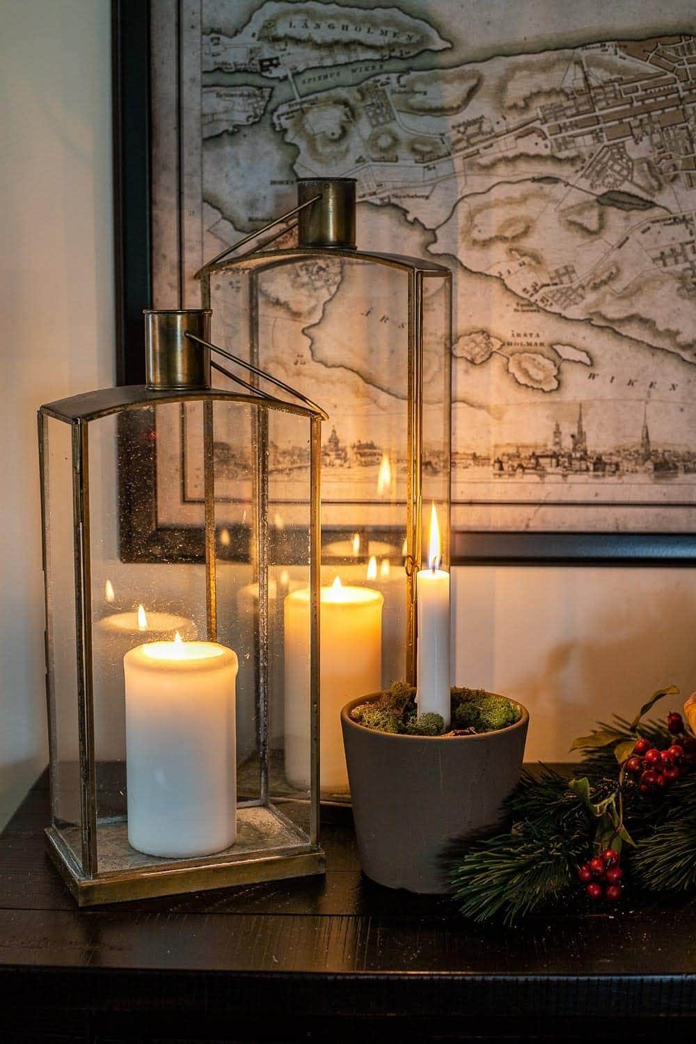 Add lanterns and candlelight to your Christmas decor to create hygge in your home.