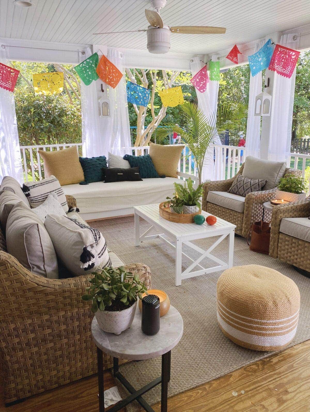 Colorful Mexican banners around back porch sitting area
