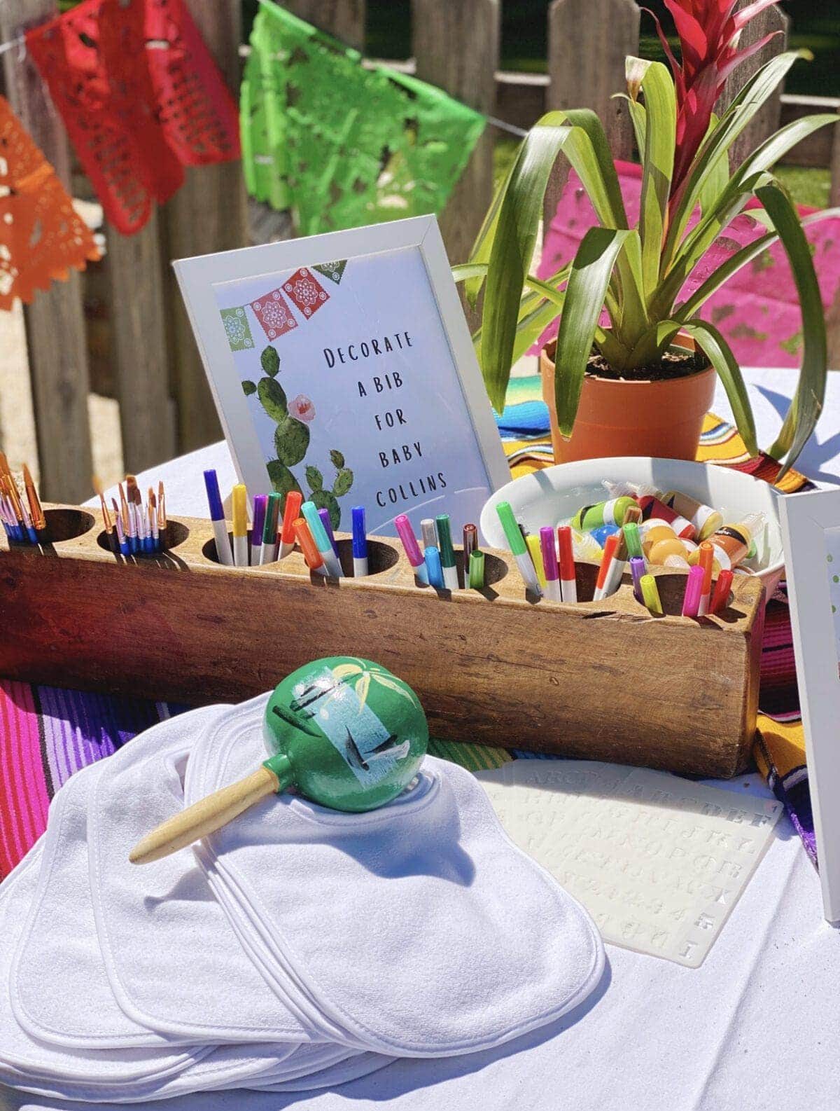 Mexican themed bib decorating station