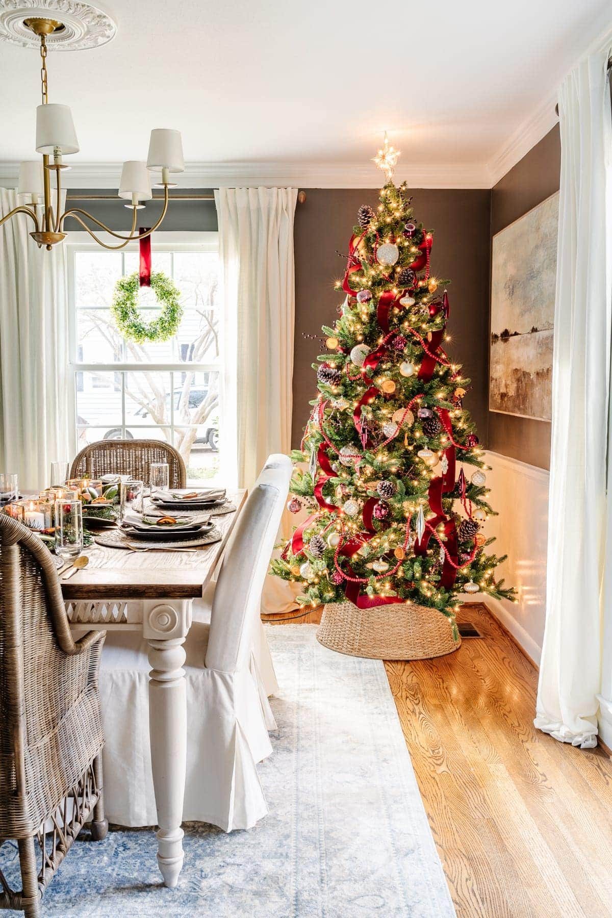 burgundy waterfall ribbon christmas tree in a dining room