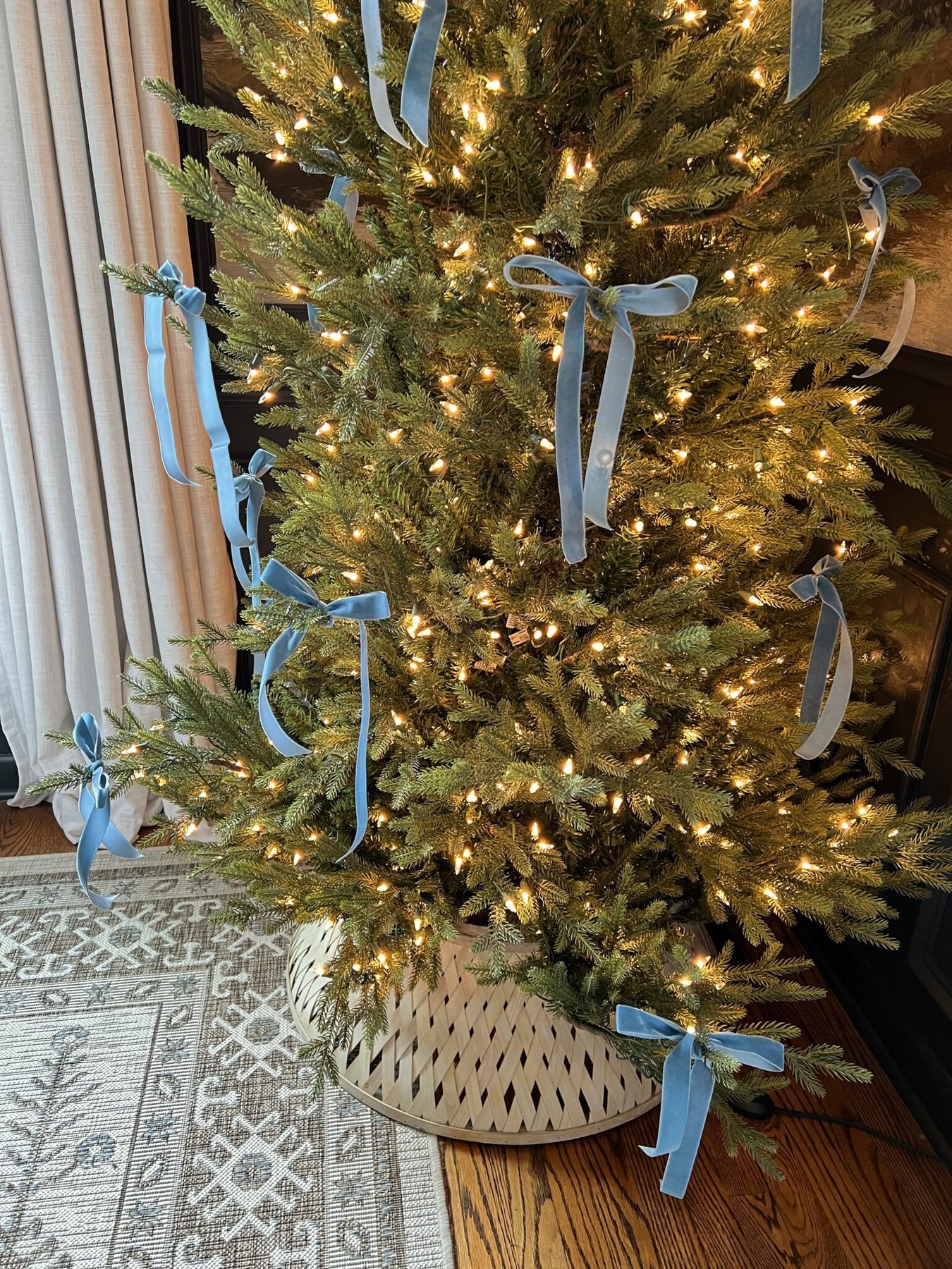 blue Christmas tree bows tied on branches
