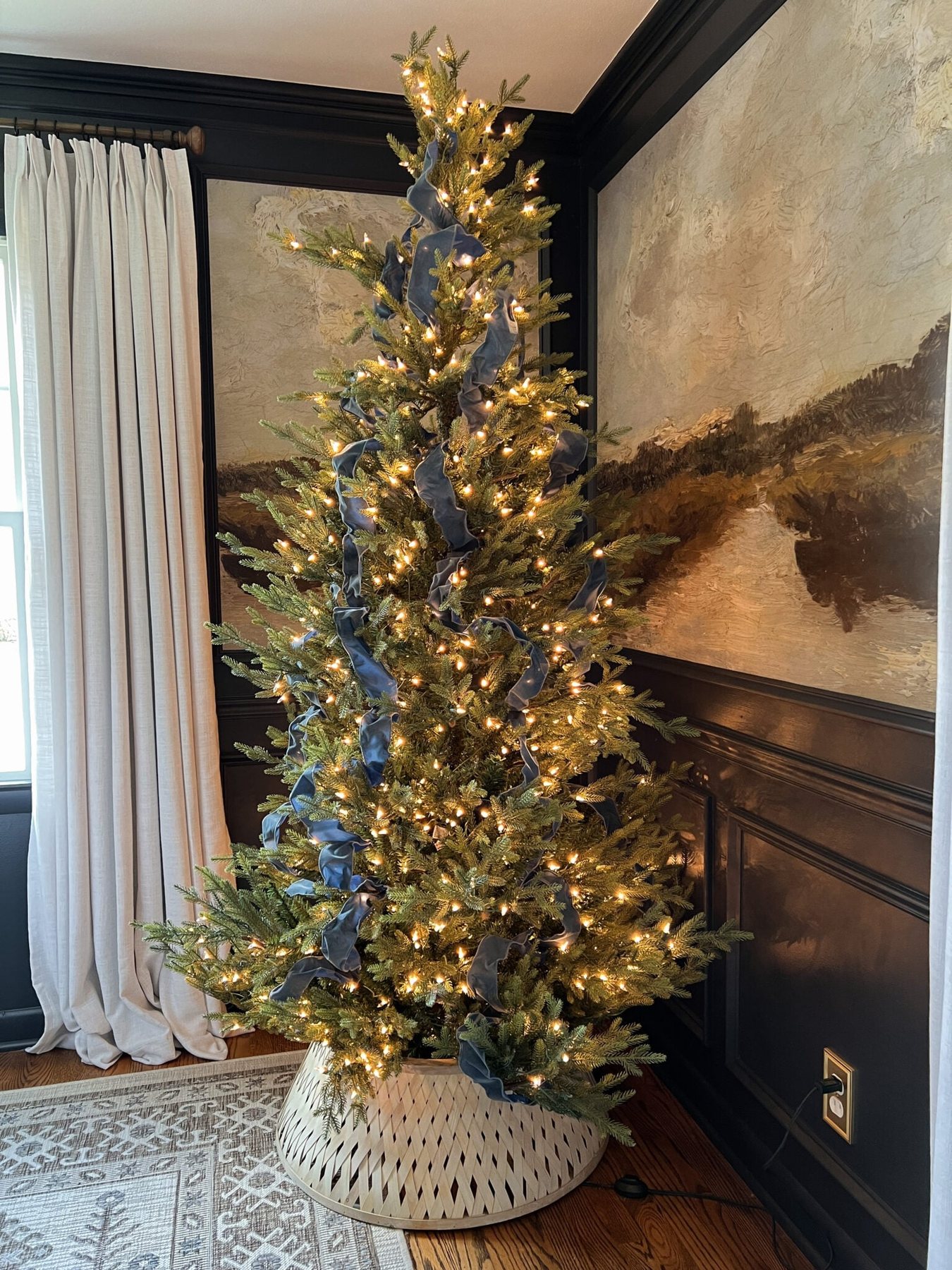 Christmas tree decorated with antique blue ribbon