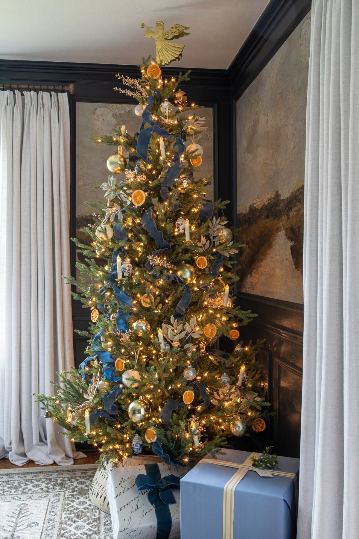 blue tree ribbon with dried oranges and gold ornaments