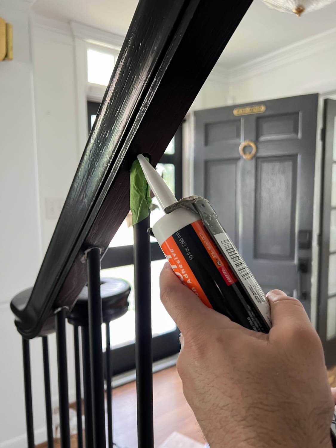 reinforcing stair balusters with construction adhesive in railing