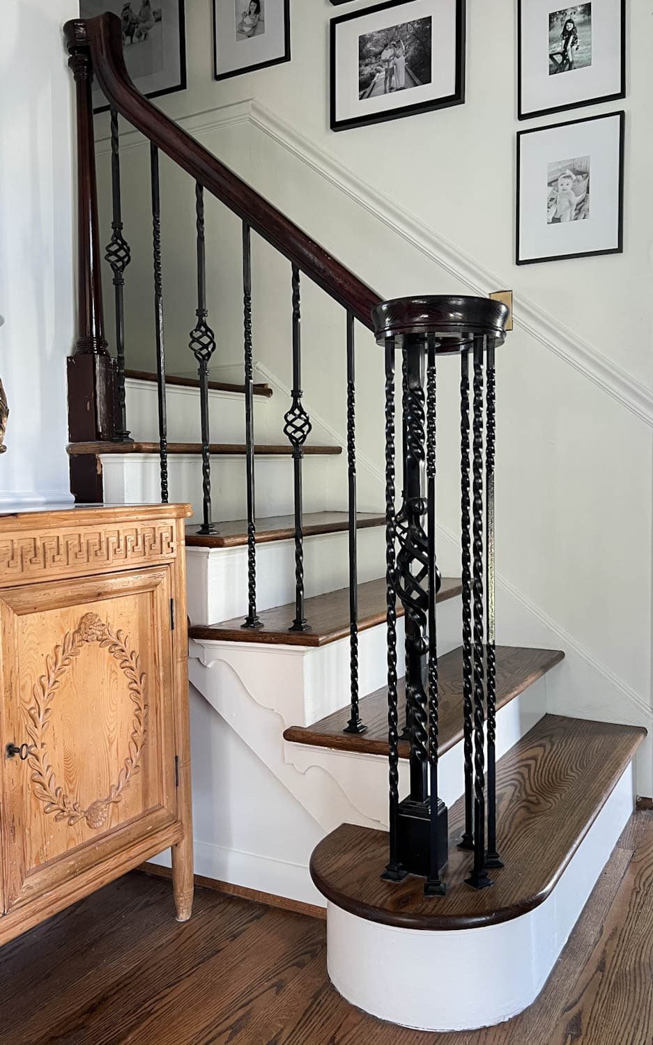 twisted iron balusters on a railing before makeover