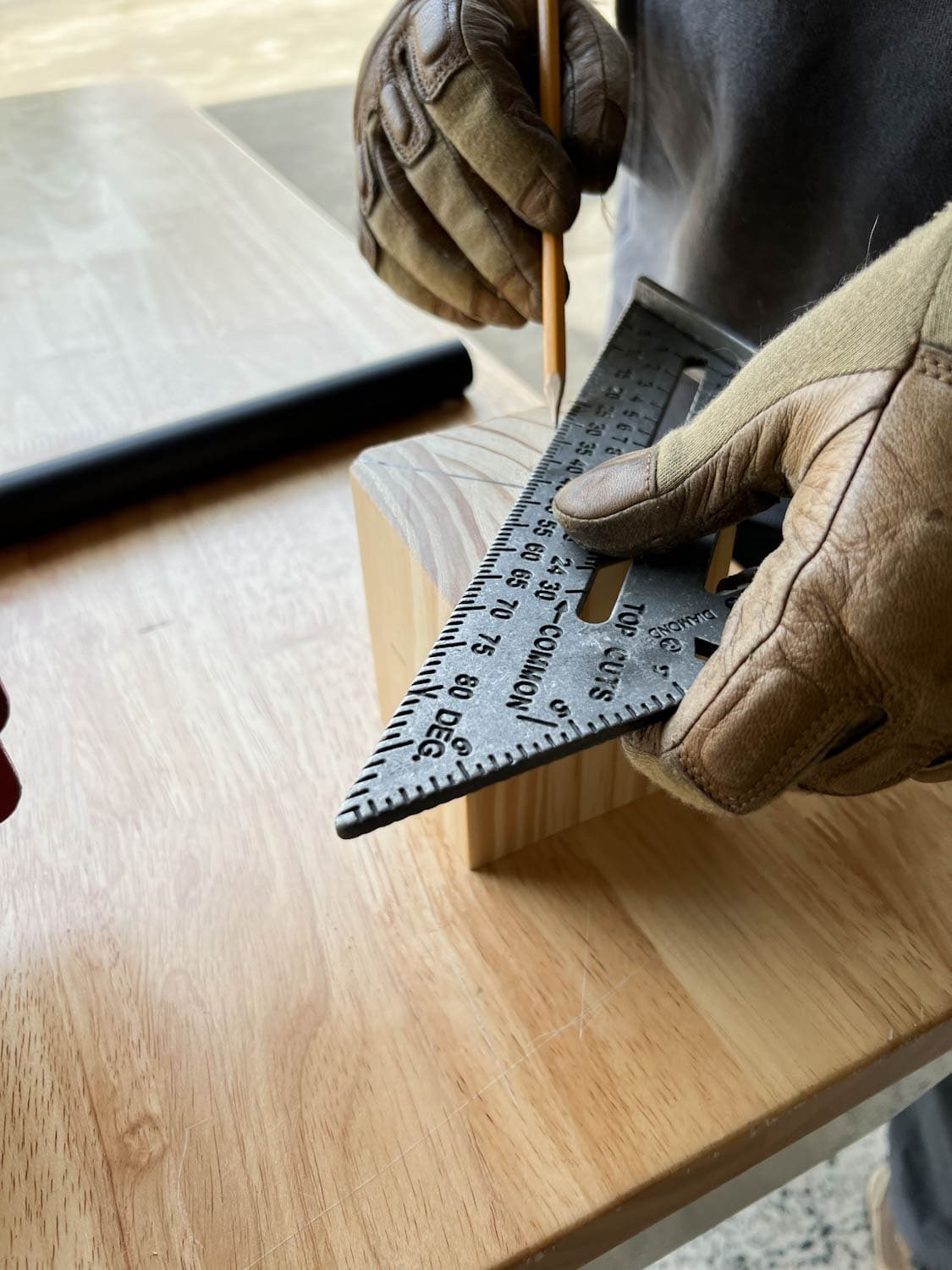 measuring a new newel post mount from a wood block